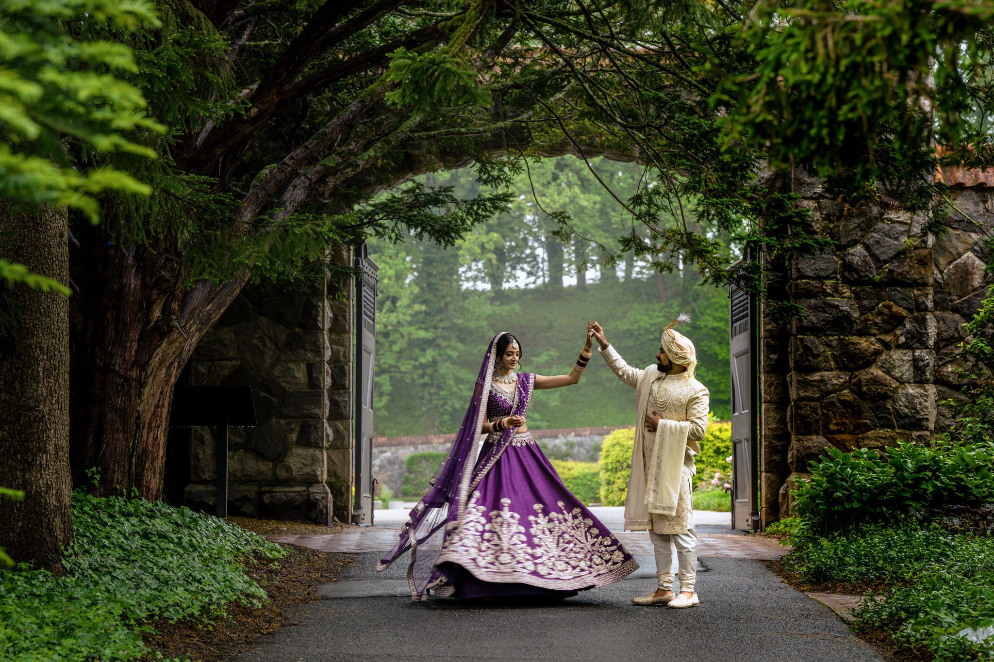 indian wedding couple share first look in conservatory gardens at biltmore estate