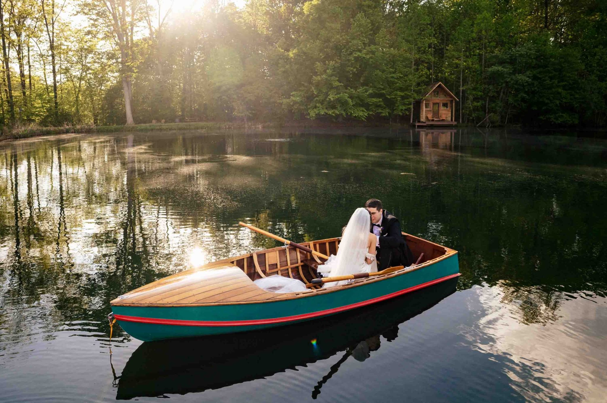 A bride and groom having a Spring engagement session on a boat at Biltmore.