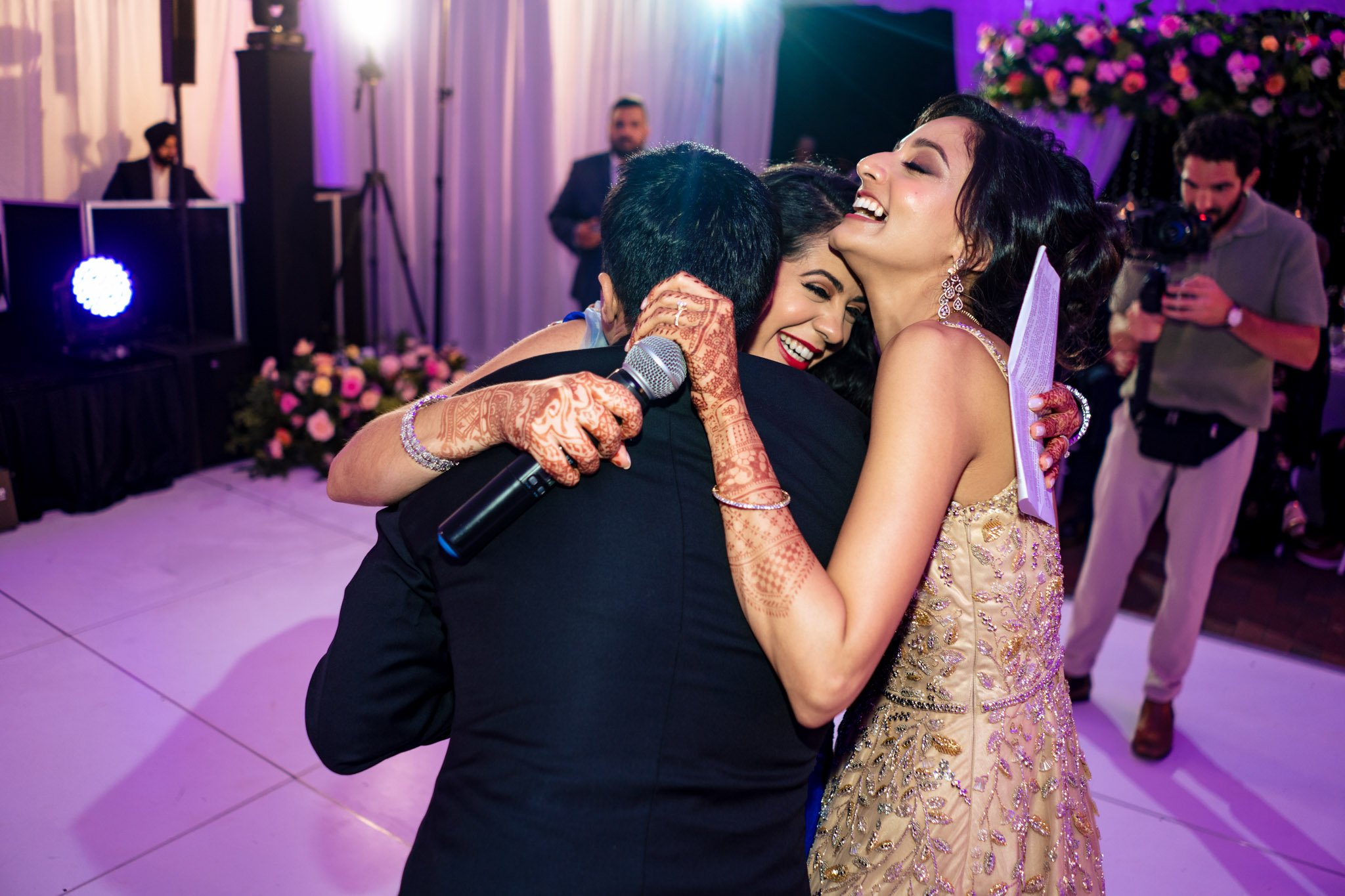 A man and woman embracing at a Biltmore Estate wedding reception.