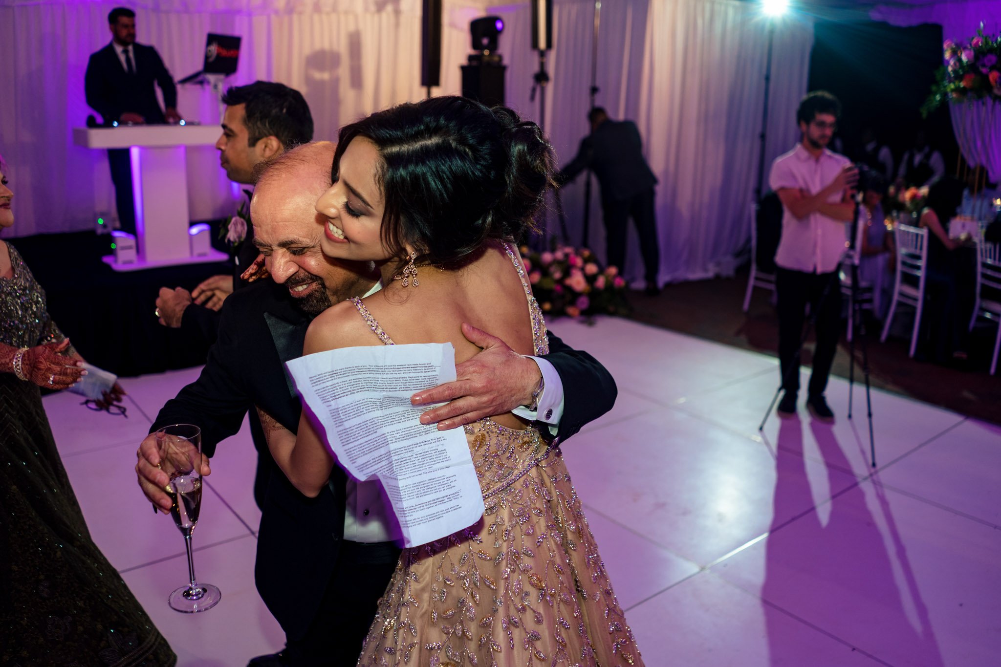 A bride and groom hugging on the dance floor at a Biltmore Estate wedding.