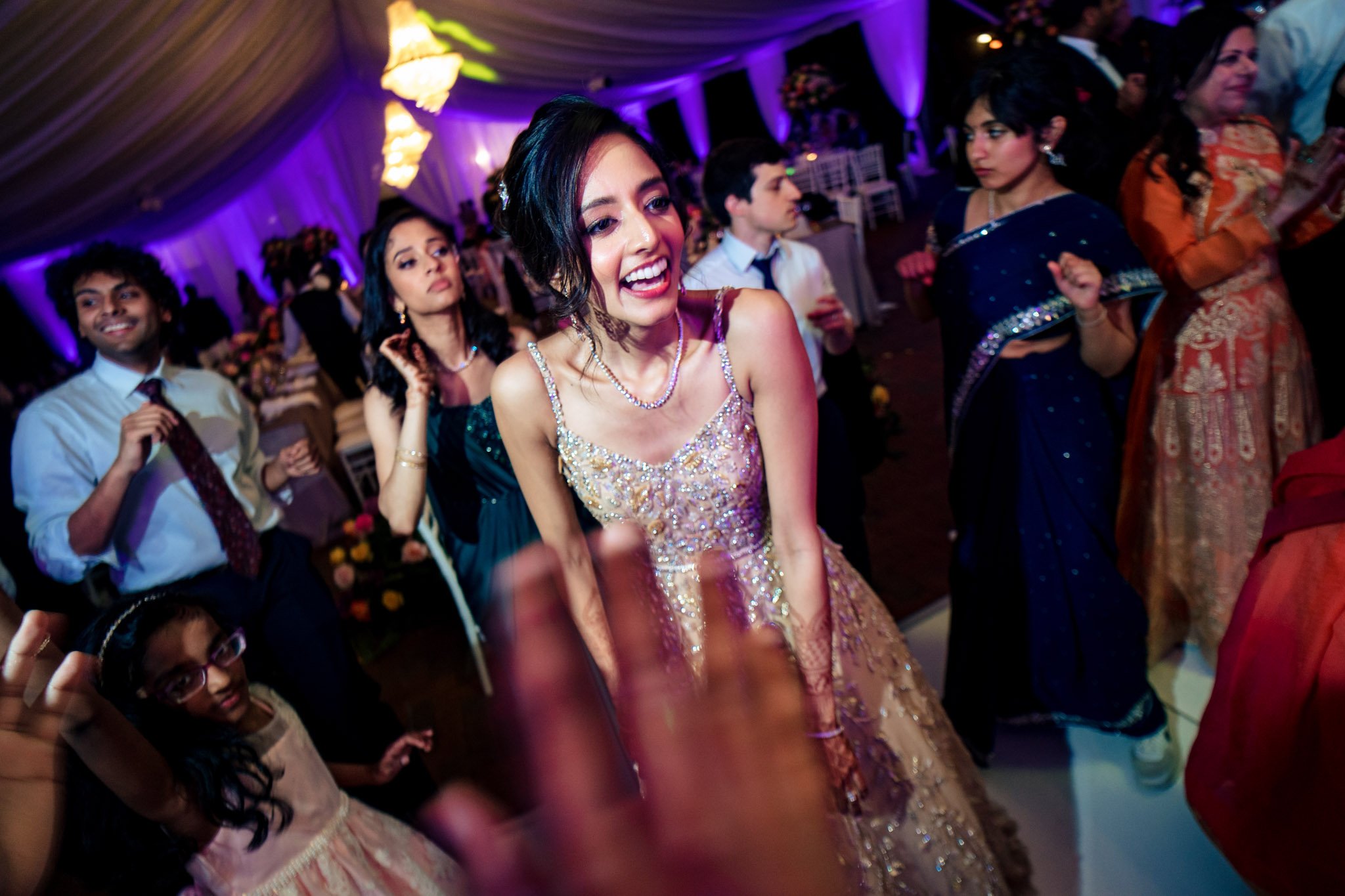 A bride dances with her friends at a Biltmore Estate wedding reception.