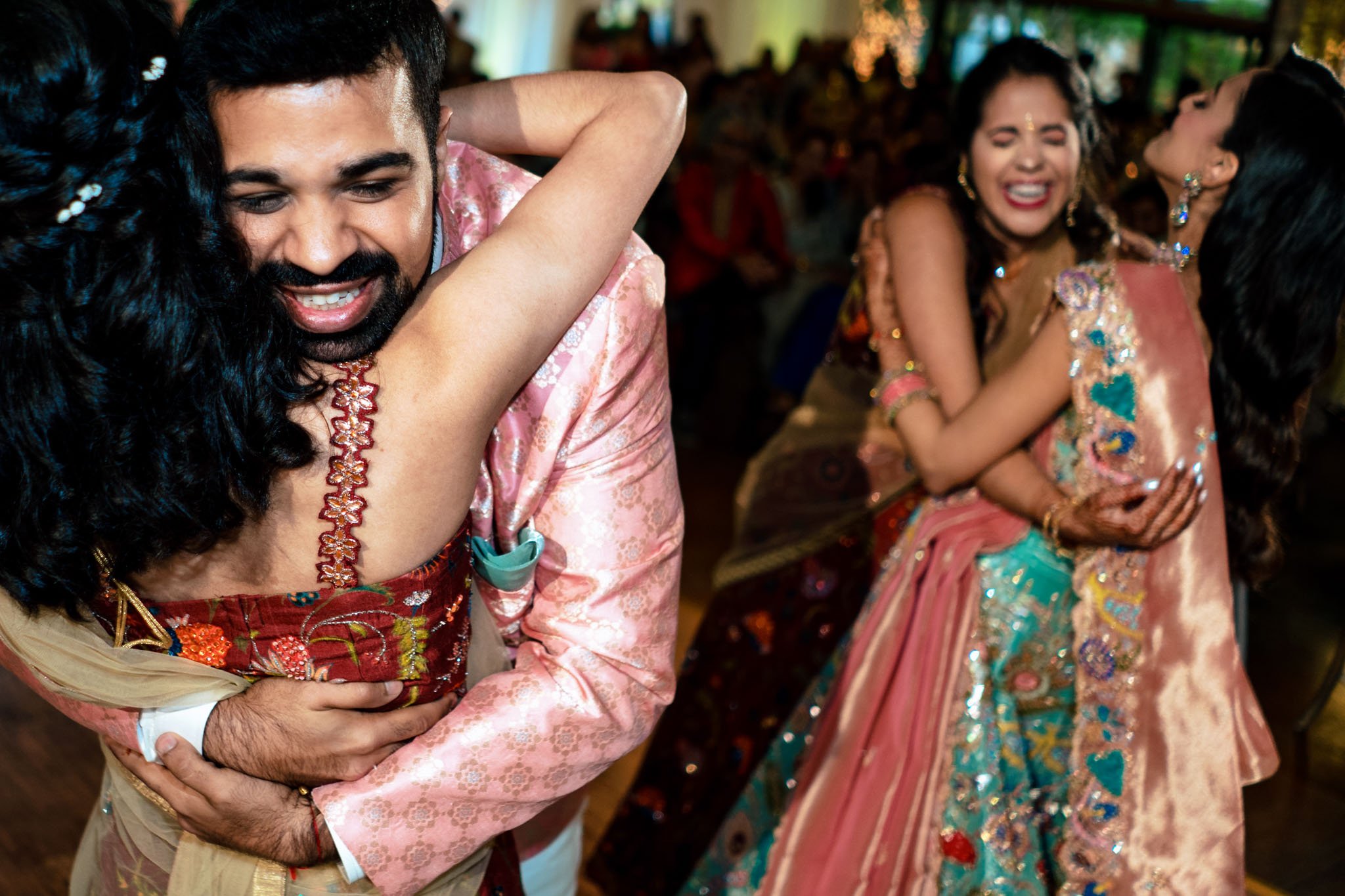 An Indian bride and groom hugging each other at a wedding reception at Biltmore Estate.