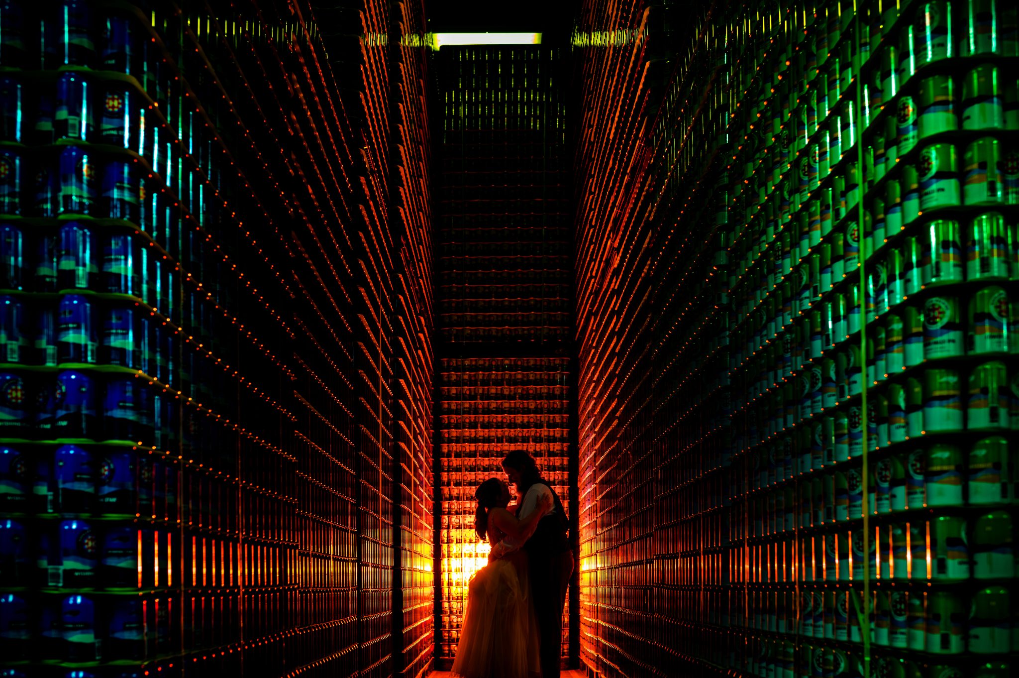 A couple celebrating their wedding at a wine cellar.