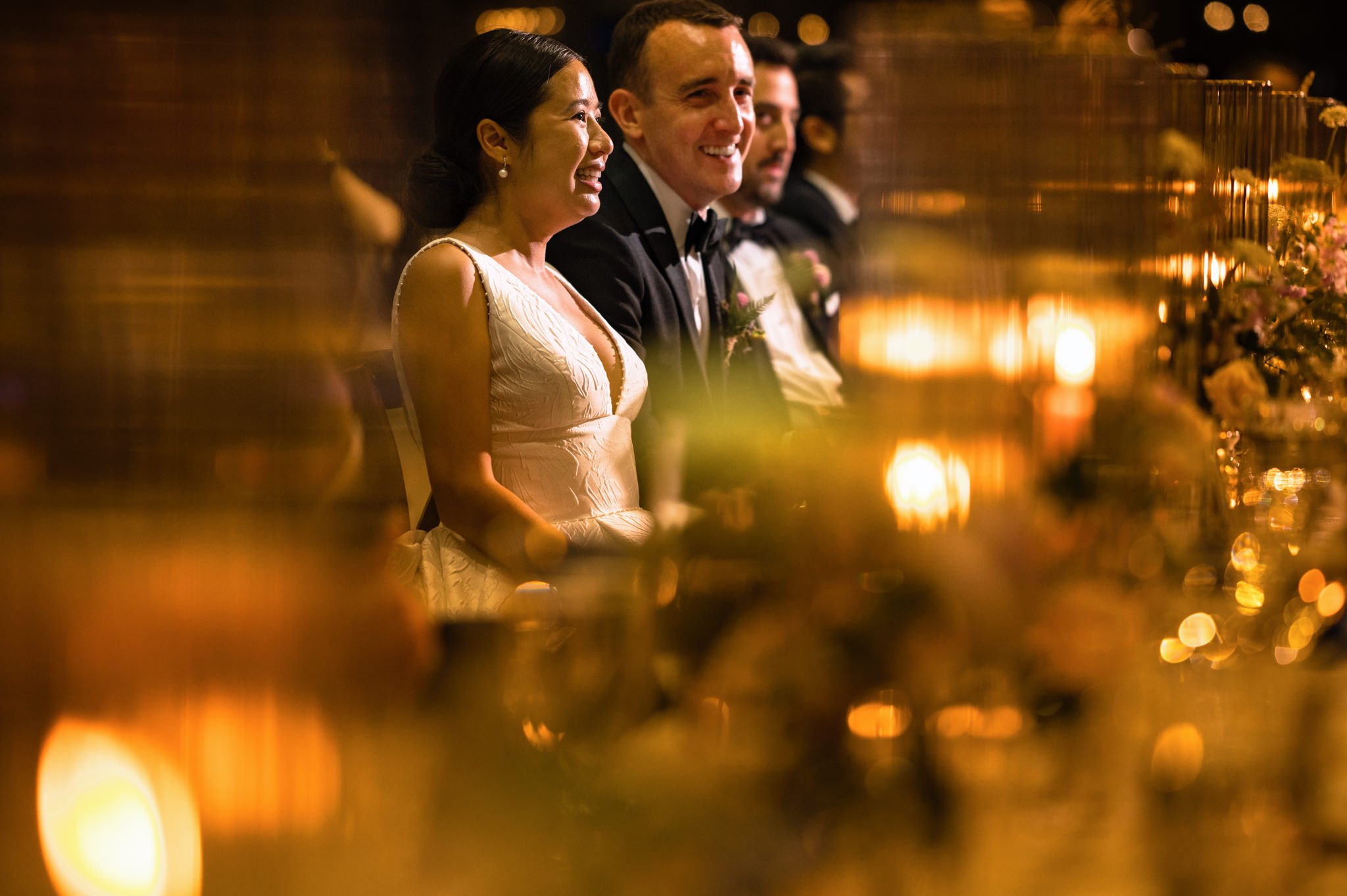 A smiling bride and groom at an old Edwards wedding reception.