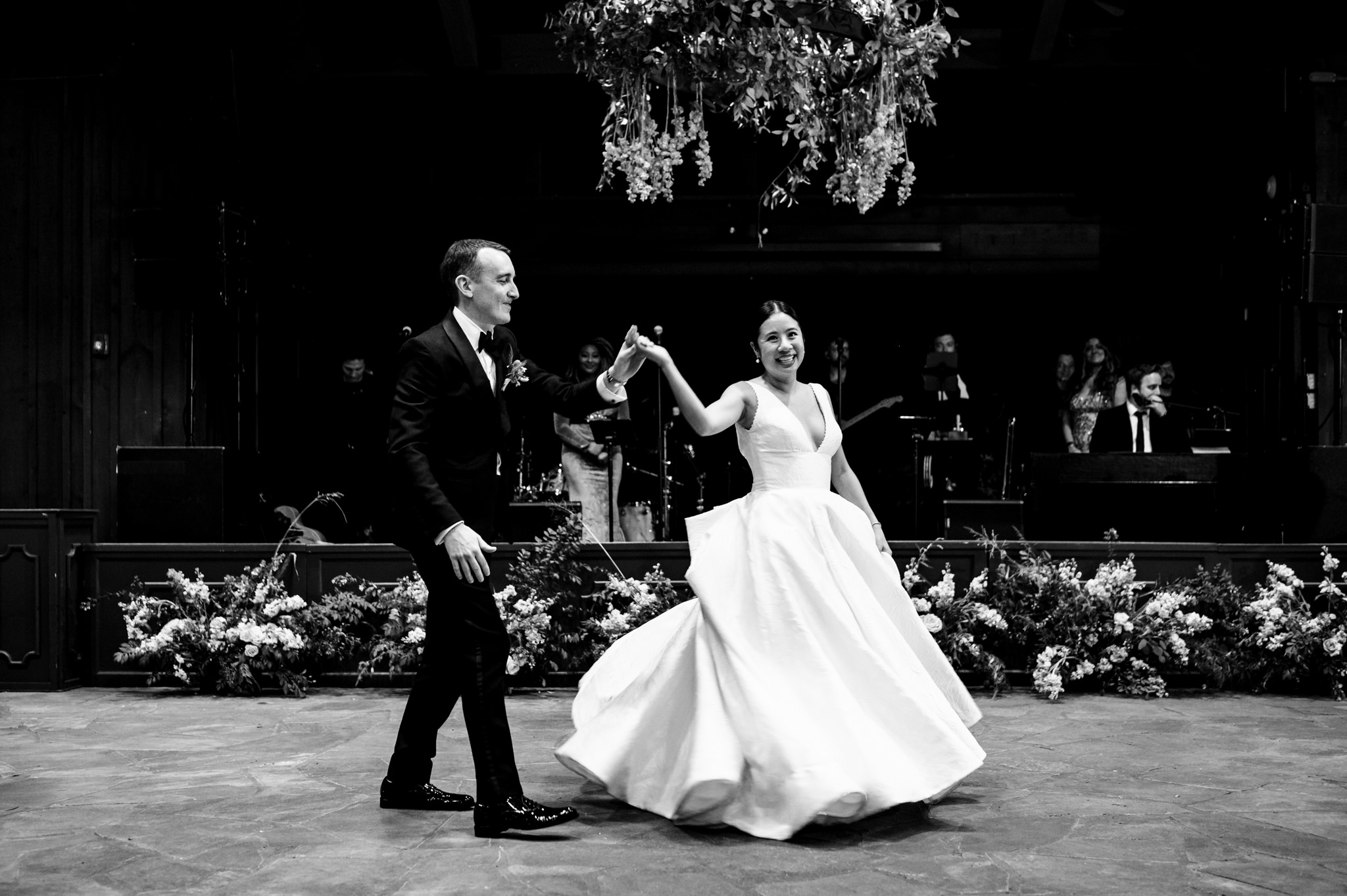 A bride and groom dancing at a farm wedding.