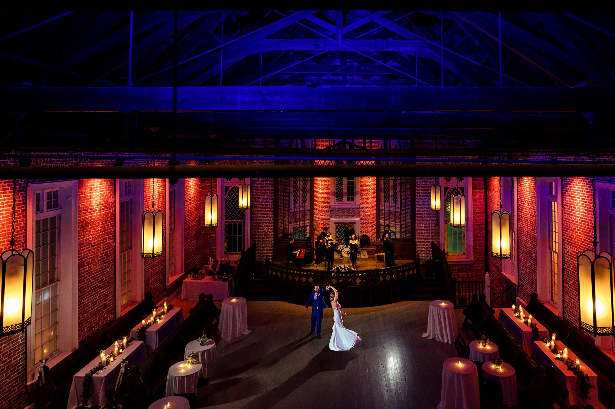 A felicity church wedding in New Orleans with a bride and groom standing in a dark room.