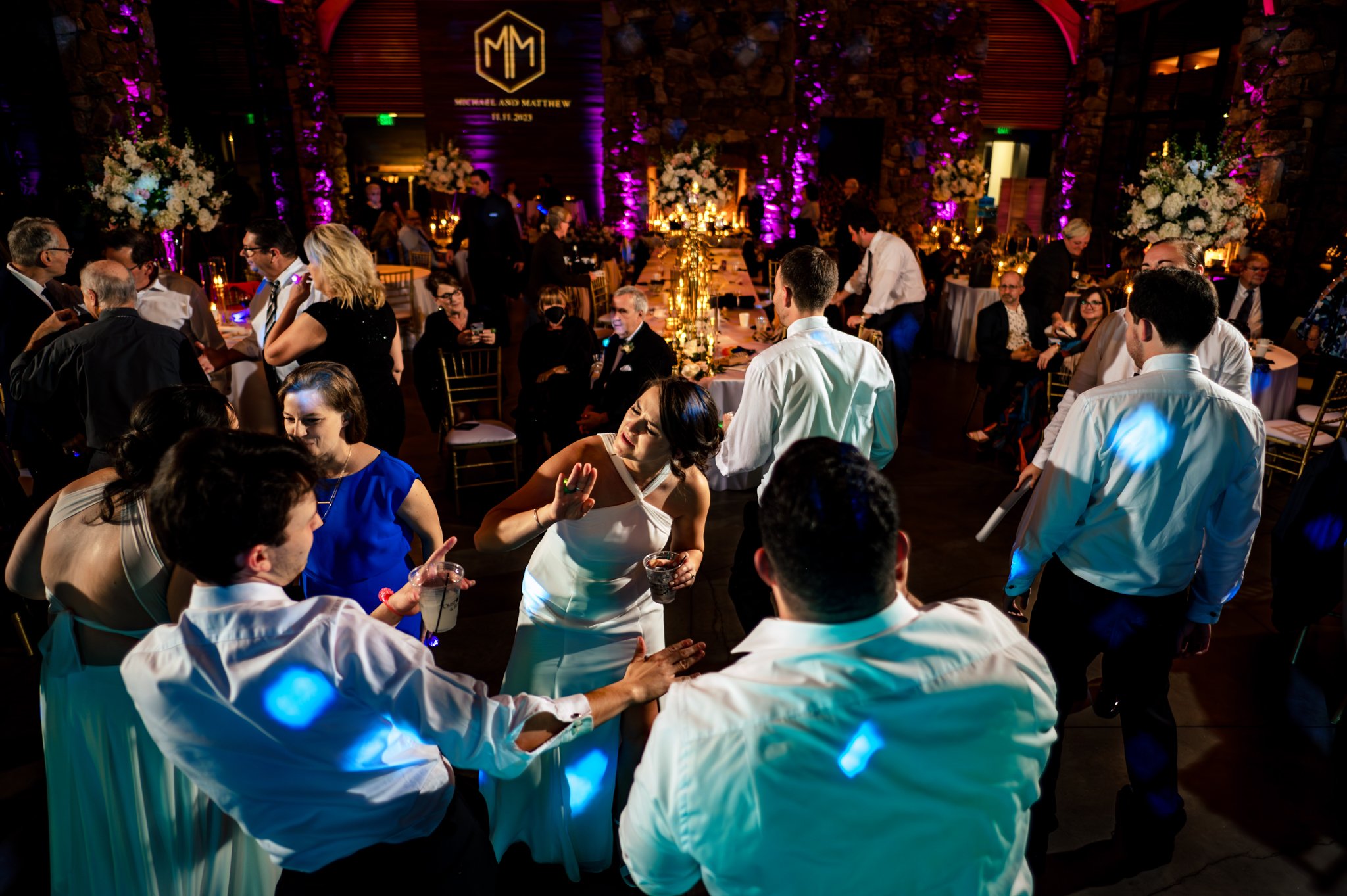 A group of people dancing at a Seely Pavilion wedding reception.