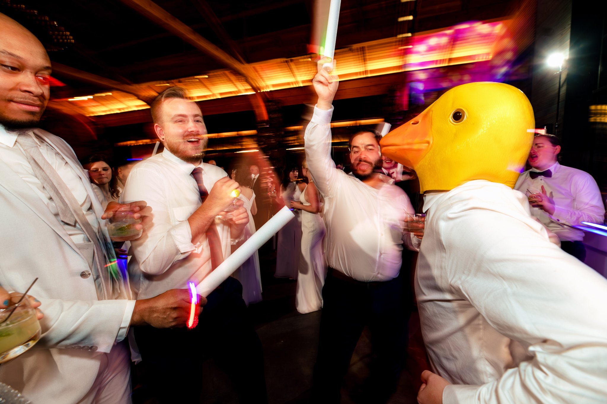A man wearing a yellow duck mask at Seely Pavilion for a Grove Park Inn wedding.
