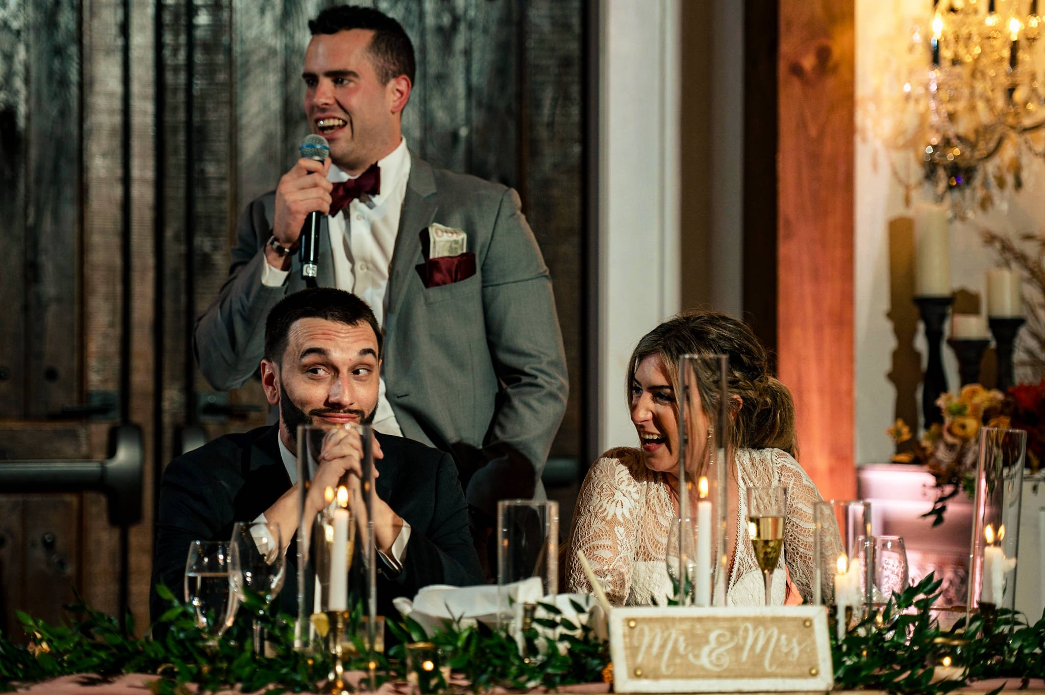 The best man delivers a heartfelt speech, leaving the bride and groom in fits of laughter at their wedding.