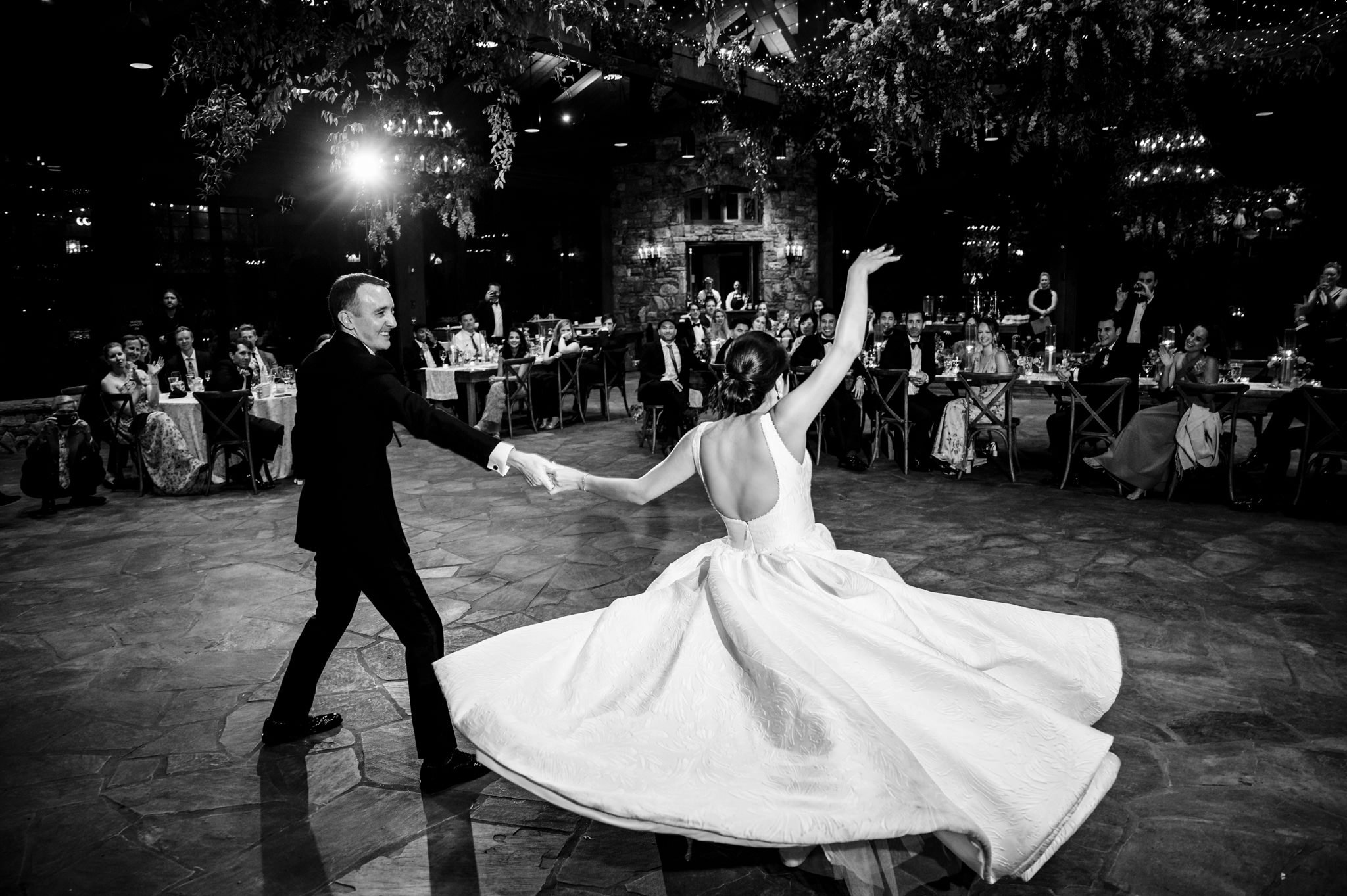 Asheville NC photographer captures a bride and groom dancing at their wedding reception.