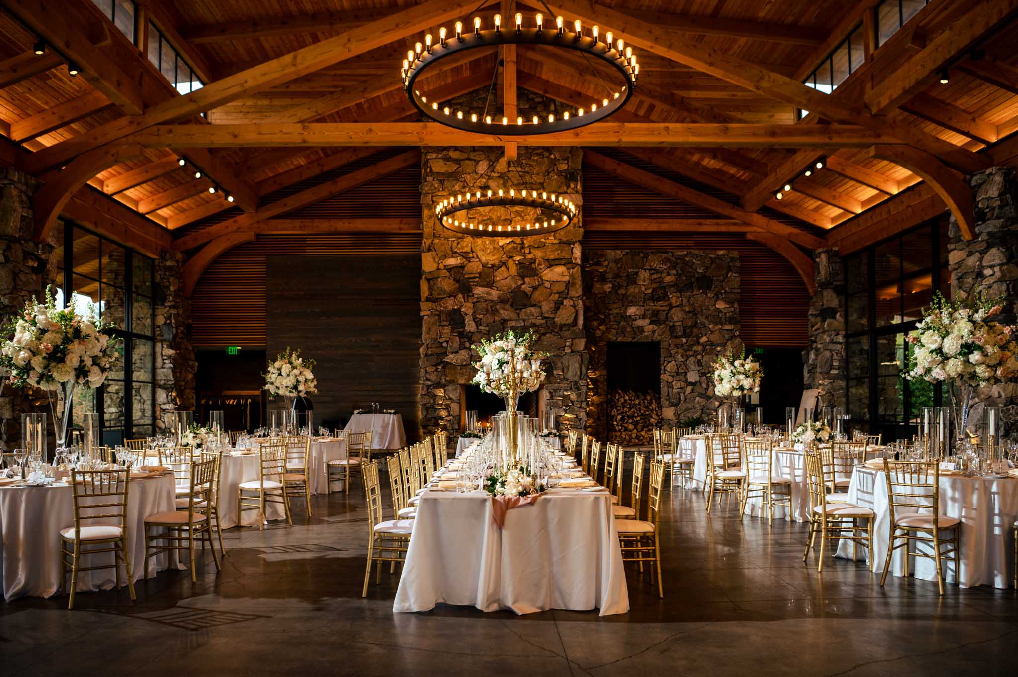 A wedding reception beautifully decorated in a log cabin.